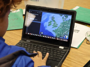 A laptop with Google Earth up