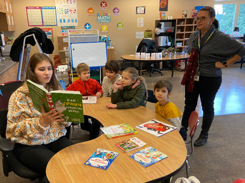 HS student reads to younger students