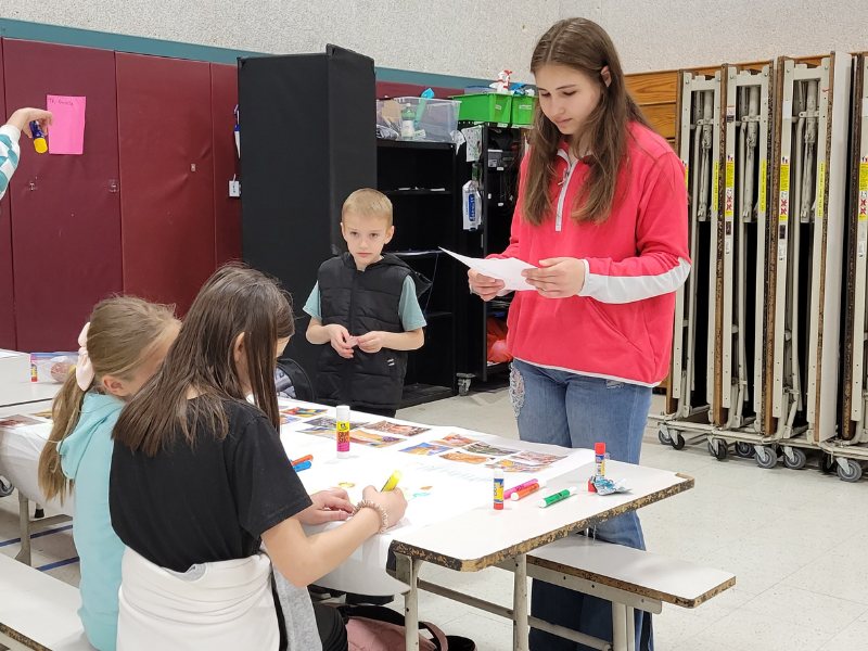 Students during culture club work on a poster