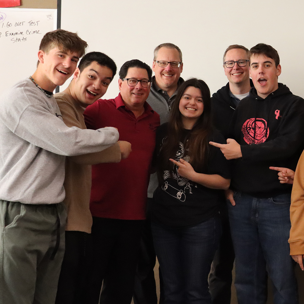 Steve Lawrence surrounded by students and Shaun, Derek.