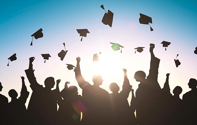 Students throwing caps in the air